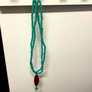 Turquoise necklace with deep red pendant. Striking necklace! Adjustable length